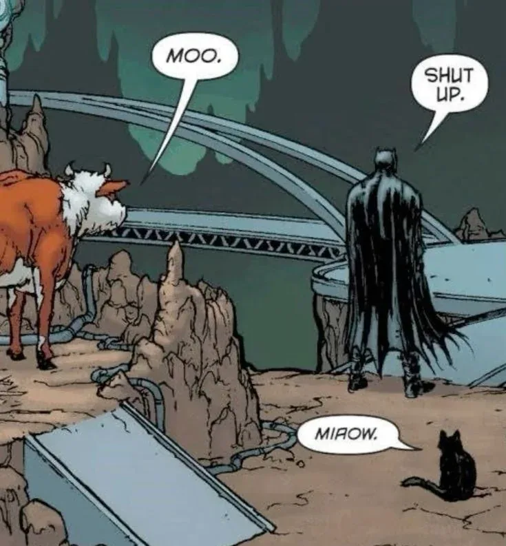 A comic panel shows a cow saying 'MOO.' while Batman, in his dark cape, stands nearby and says 'SHUT UP.' A black cat sits…