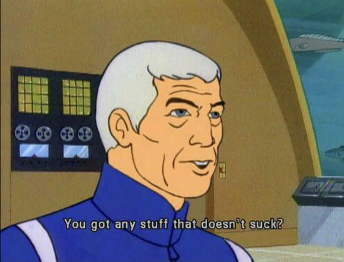 A cartoon man with white hair and a blue uniform looks slightly skeptical while speaking. Behind him are control panels with…