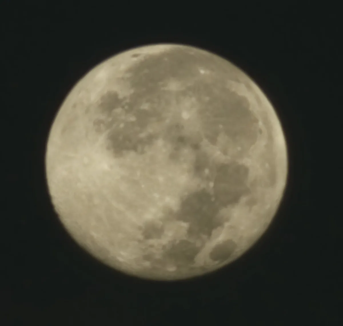 A close-up photograph of the full moon against a dark sky, showing its craters and surface details. Overlaid text in white…