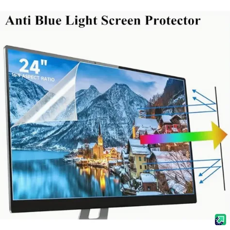 A 24-inch monitor displays a snowy mountain village scene, with a transparent screen protector partially peeled back on the…
