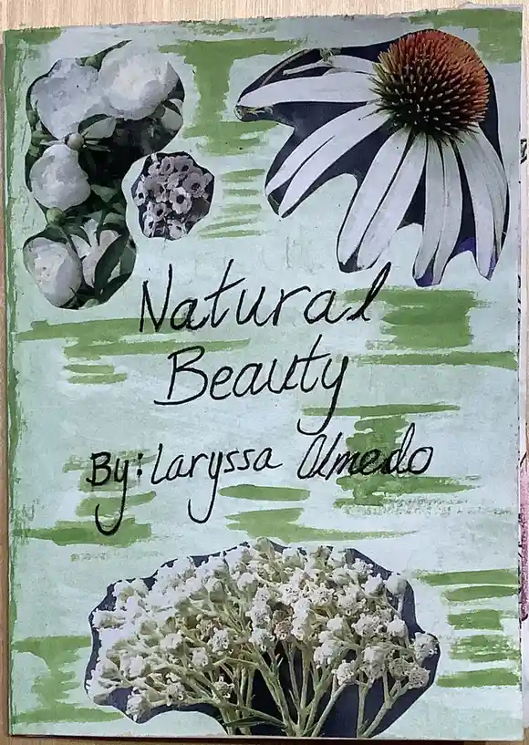 A handmade book cover with a light green painted background and three cut-out floral images: white peonies, a purple…