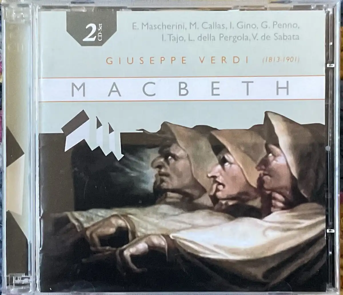 The image shows the cover of a classical music CD for Giuseppe Verdi's opera 'Macbeth,' featuring a dramatic painting of…