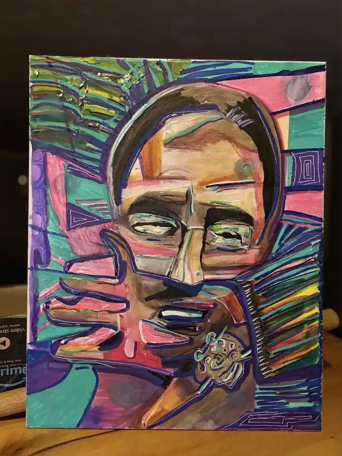 A colorful, abstract painting of a person's face with exaggerated features and vibrant, chaotic brushstrokes in pink, teal…