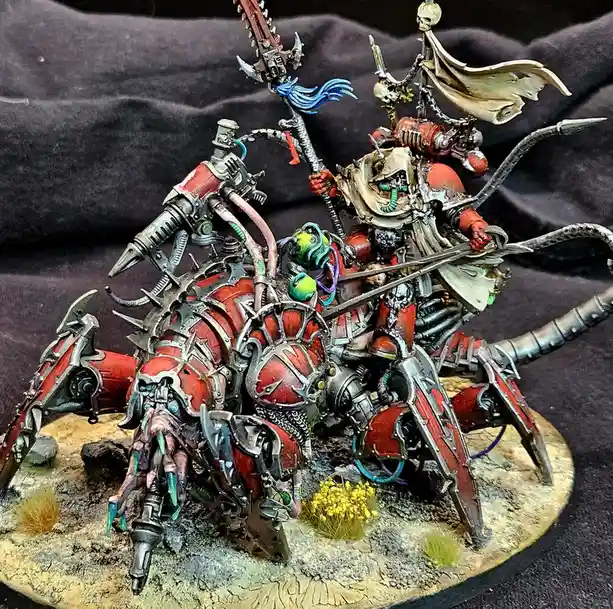 A highly detailed, custom-painted miniature of a red and silver armored, biomechanical warlord riding a monstrous…