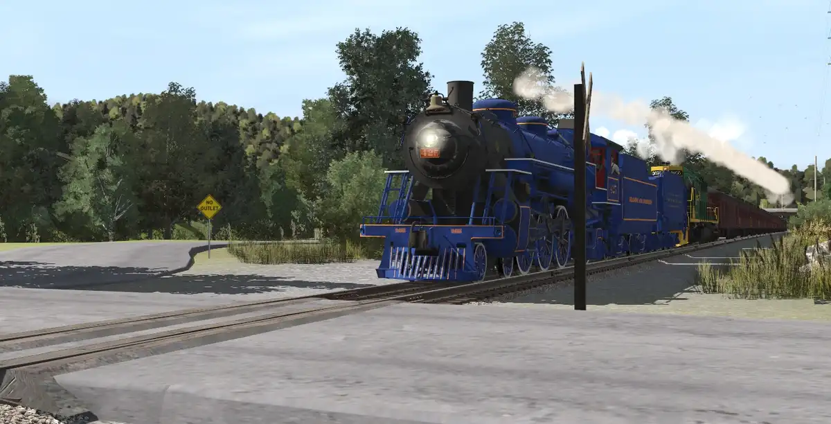 A blue steam locomotive with a bright headlight and billowing white smoke is traveling on train tracks that curve toward a…