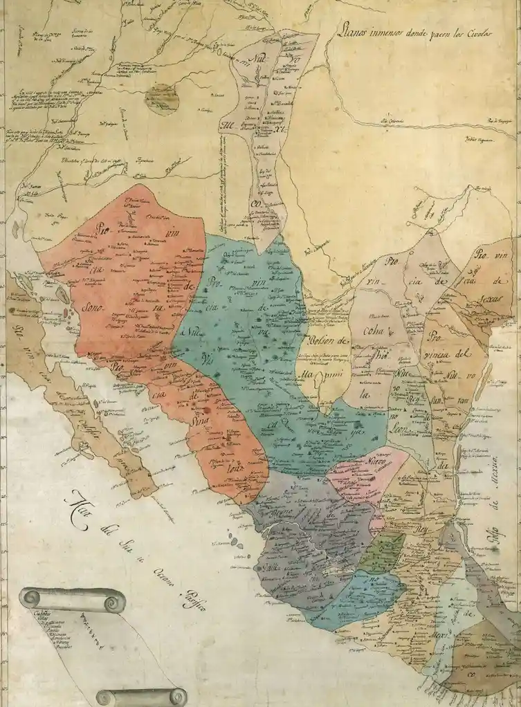 An old, hand-drawn, sepia-toned map of Mexico with various regions colored in pink, blue, beige, and gray, labeled with…