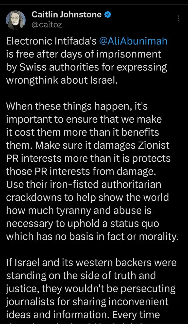 A screenshot of a tweet by Caitlin Johnstone (@caitoz) with a black background and white text. The tweet announces that Ali…