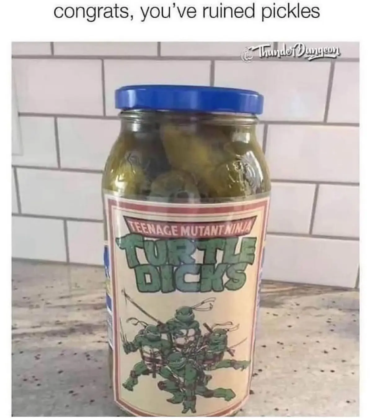 A jar of pickles with a custom label parodying Teenage Mutant Ninja Turtles, reading 'TEENAGE MUTANT NINJA TURTLE DICKS'…