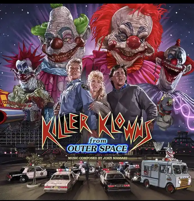 The image is the movie poster for 'Killer Klowns from Outer Space,' featuring four grotesque, menacing clowns looming over…