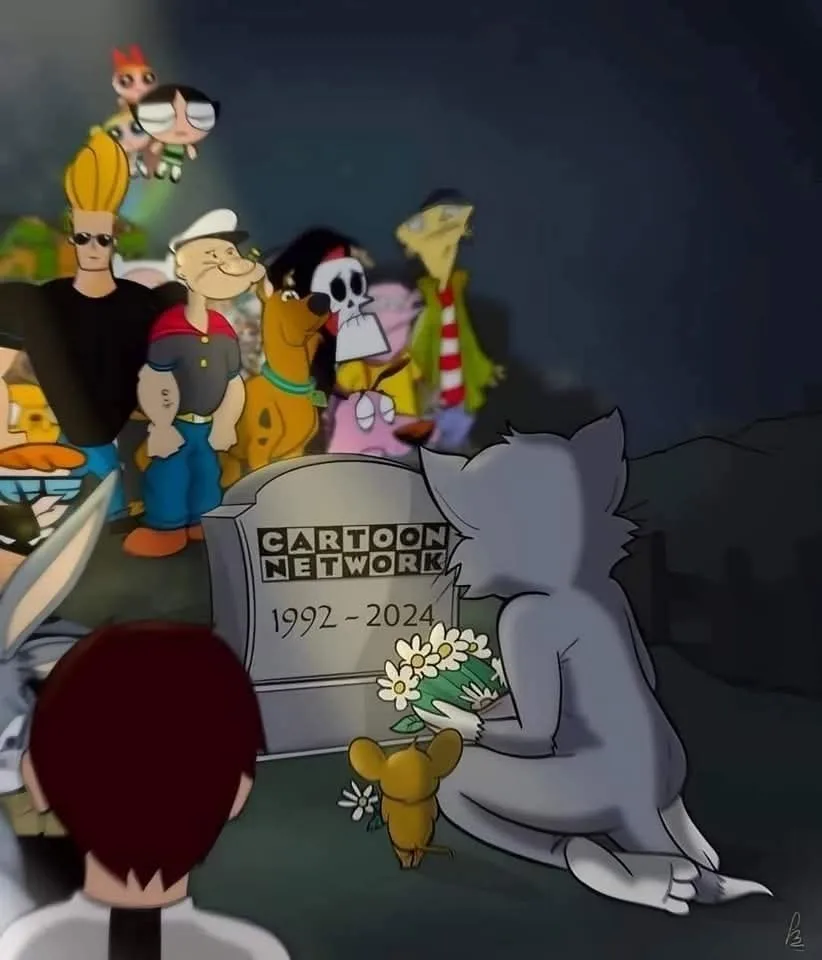 A somber cartoon scene depicts a gray cat kneeling before a tombstone engraved with 'CARTOON NETWORK 1992 - 2024', holding…
