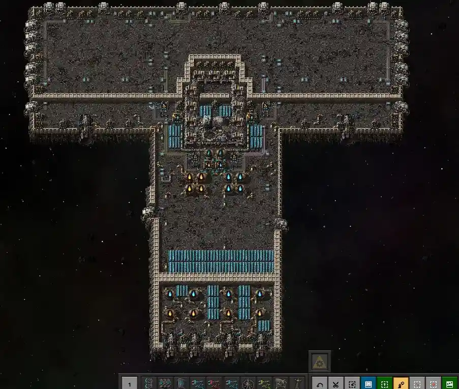 A screenshot from the game Factorio showing a massive, intricate space station built in the shape of a large letter 'T' with…