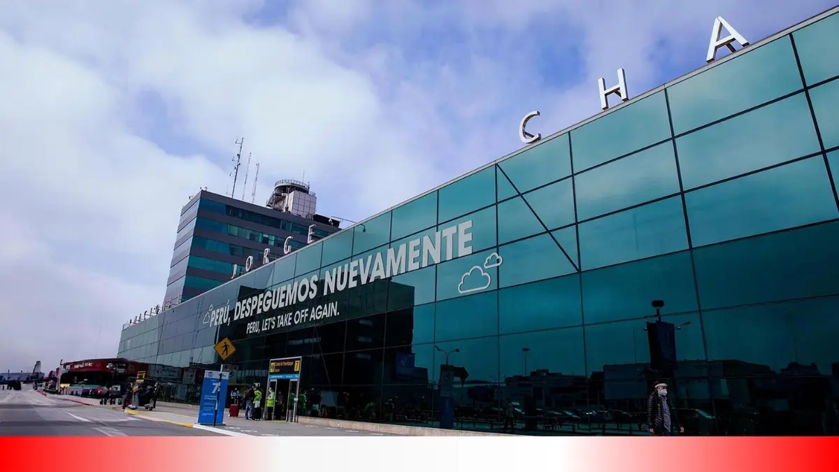 An exterior photo of Jorge Chávez International Airport in Lima, Peru, showing its glass facade with the large white text…