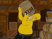 A six-panel comic strip from The Simpsons shows Homer Simpson in a brewery, struggling to lift a barrel labeled 'BEER' with…
