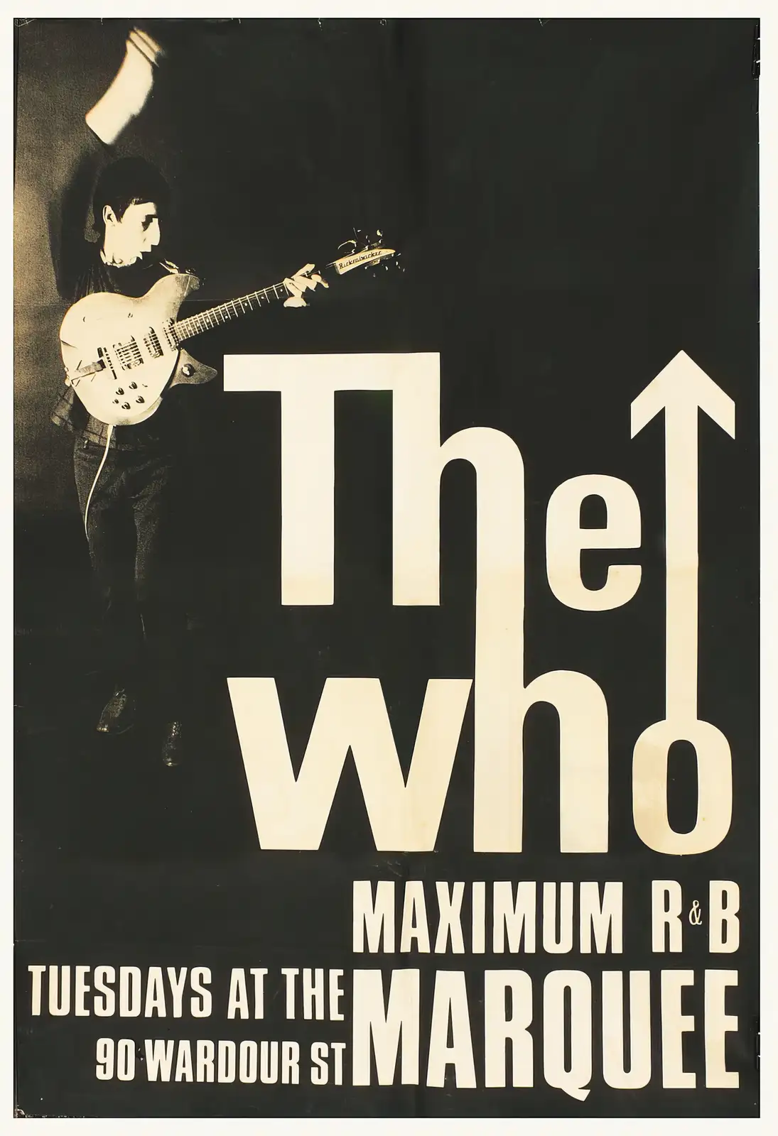 A vintage black-and-white promotional poster for The Who, featuring a musician playing a white electric guitar against a…