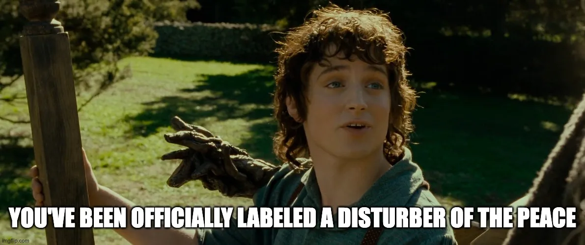 A still from 'The Lord of the Rings' shows Frodo Baggins looking surprised as a dark, gnarled hand emerges from behind him…