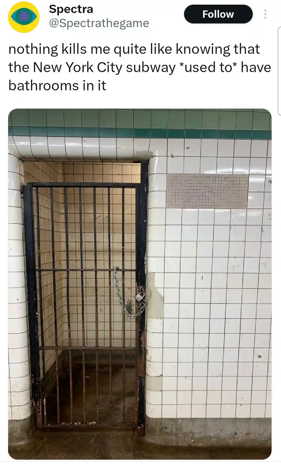 The image shows a dilapidated, locked bathroom stall in a subway station, featuring white and green tiled walls, a rusted…