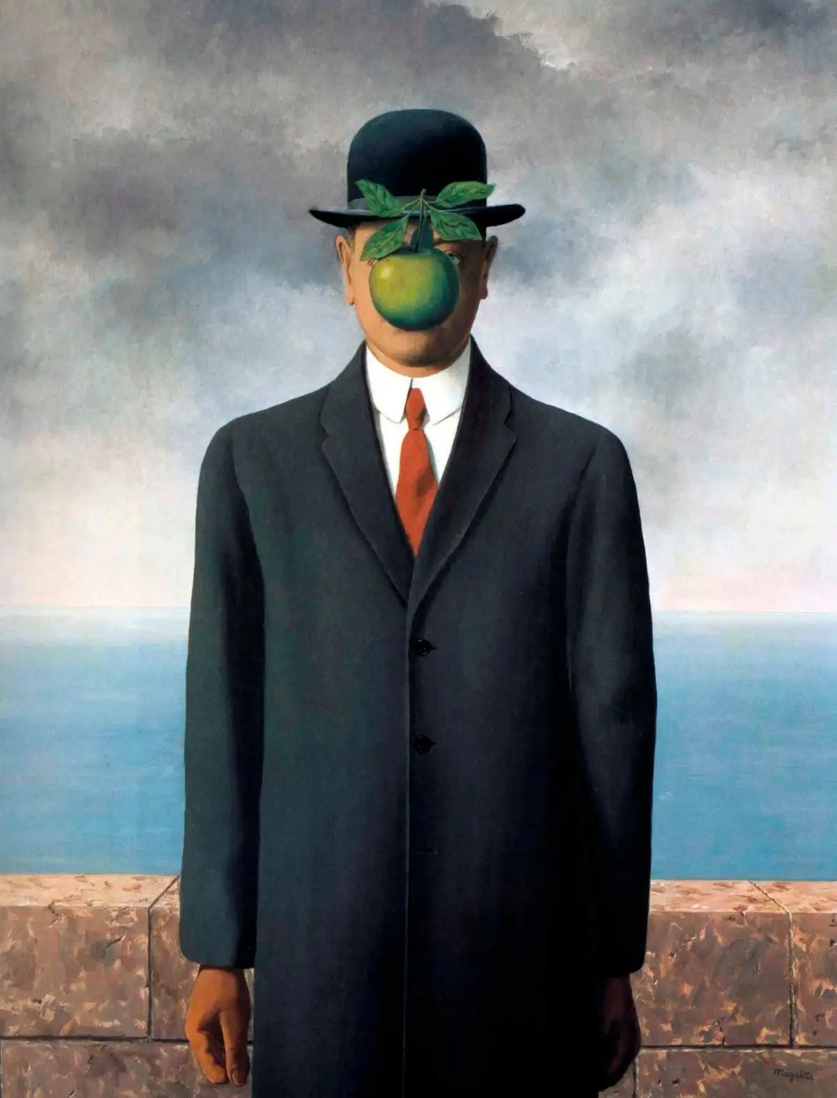A man in a dark suit and bowler hat stands against a cloudy sky and sea, with a green apple and stem obscuring his face. The…