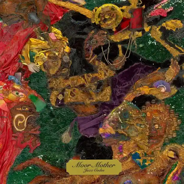 An abstract, textured collage artwork featuring layered fabrics, beads, and metallic elements in rich reds, golds, and…