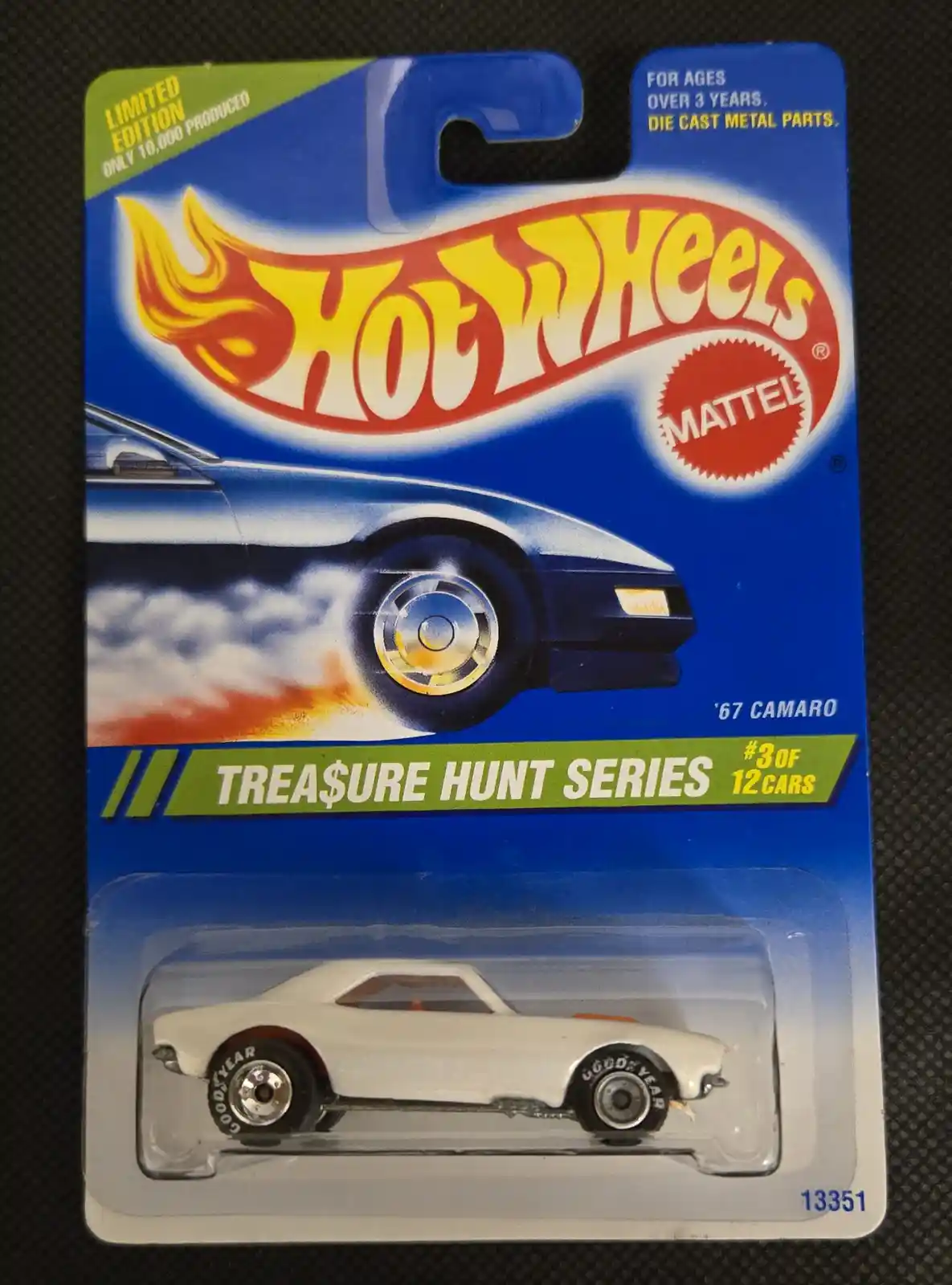 A Hot Wheels toy car package for a '67 Camaro from the Treasure Hunt Series, featuring a white die-cast car in the blister…