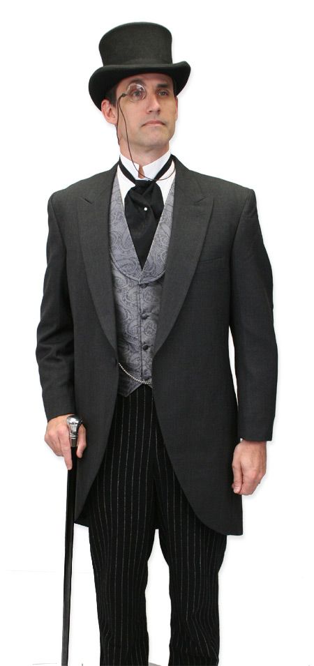 A man dressed in a formal black top hat, glasses, a black tailcoat, patterned vest, and pinstripe trousers, holding a cane…
