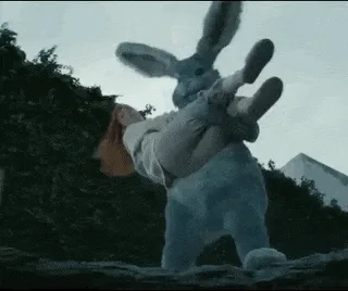 A sequence of six frames shows a giant, furry rabbit costume carrying a person upside down, then dropping them, and finally…