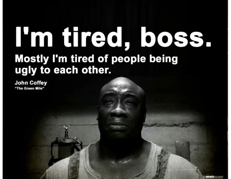 A black-and-white image of John Coffey from 'The Green Mile' looking weary and sad, with large white text overlaid that…