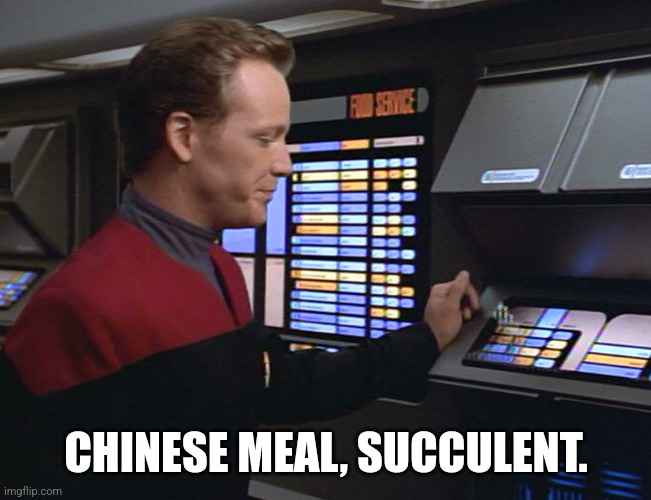 A man in a red Starfleet uniform is at a futuristic food service terminal, selecting a meal. The screen behind him displays…