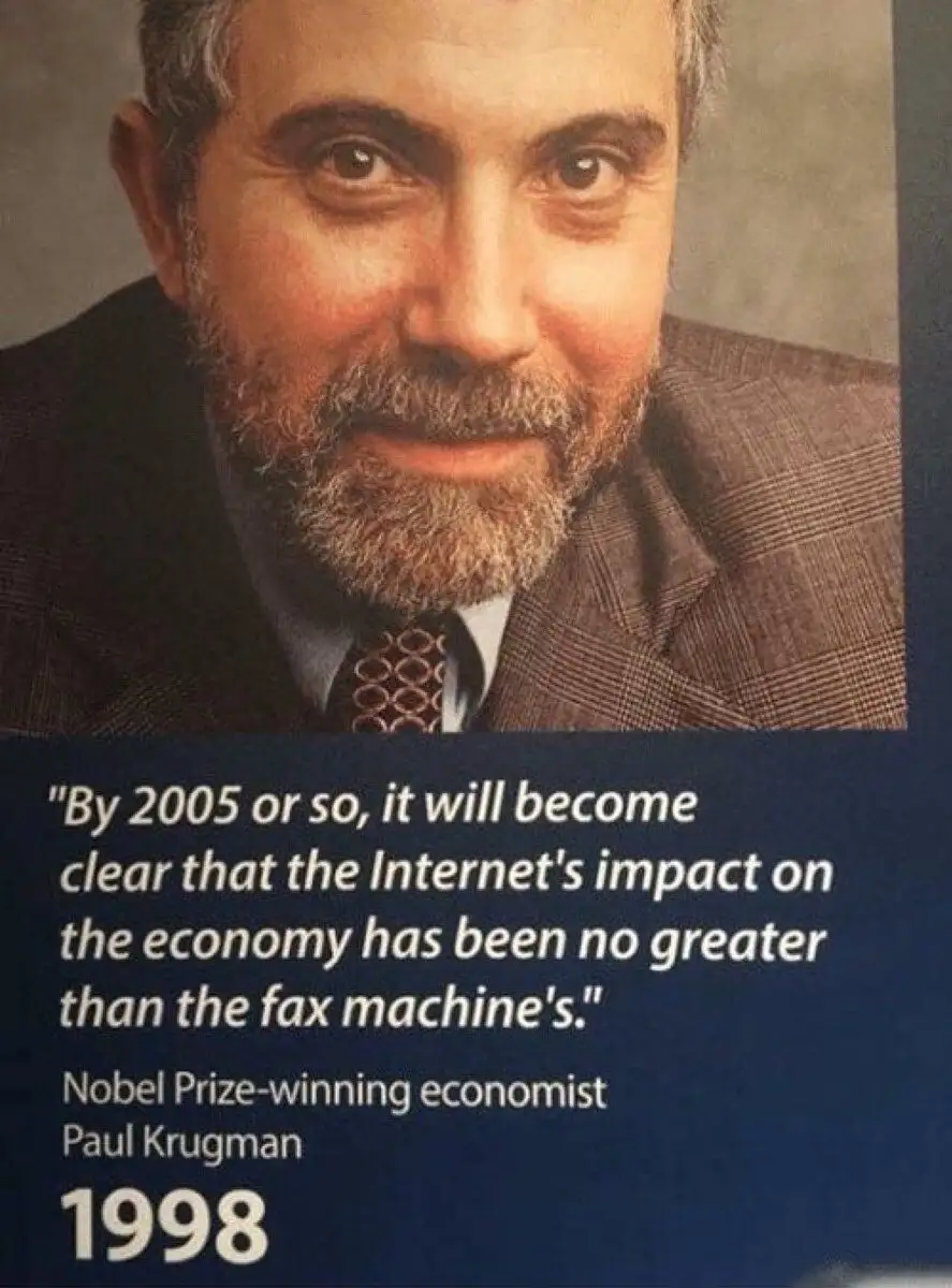 A 1998 photo of Nobel Prize-winning economist Paul Krugman, who is shown smiling in a suit and tie. Overlaid text quotes him…