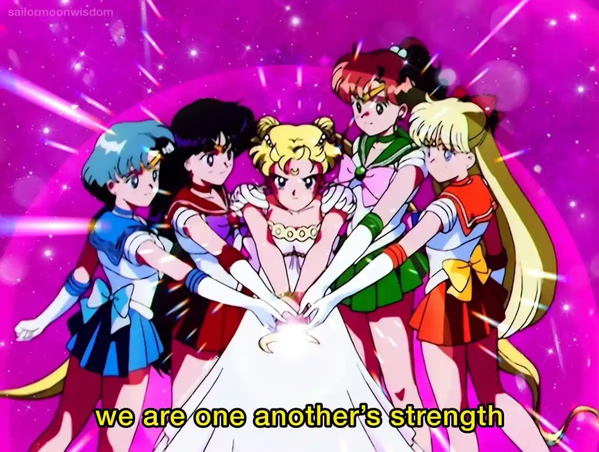 Five anime characters in sailor uniforms stand in a circle, their hands joined in the center over a glowing orb against a…