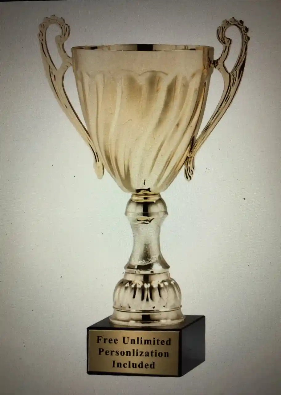 A gold-colored trophy with ornate handles and a black base is shown against a plain background. The base has a plaque with…