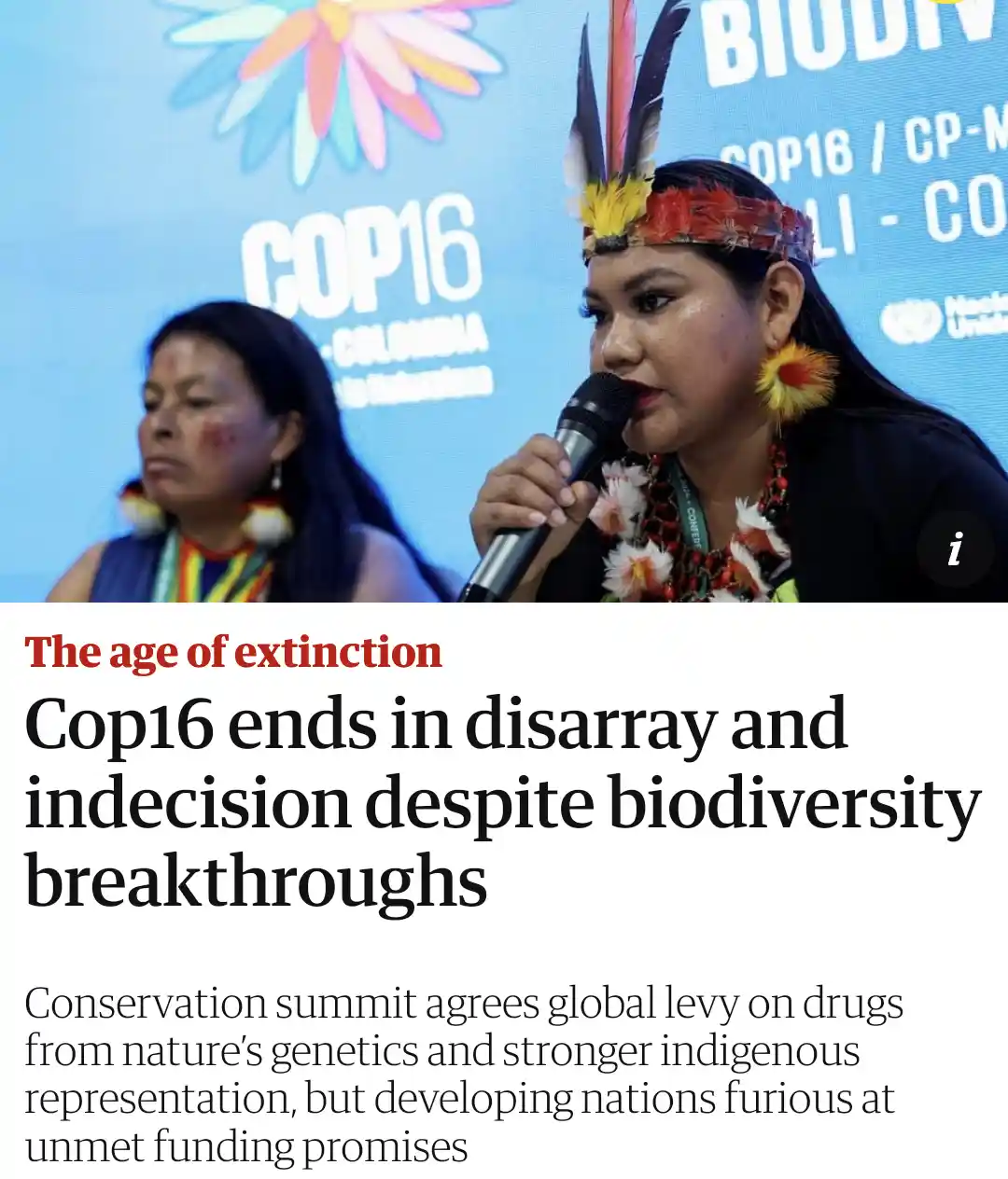 A photo shows two indigenous women at a COP16 biodiversity summit, one speaking into a microphone while wearing traditional…