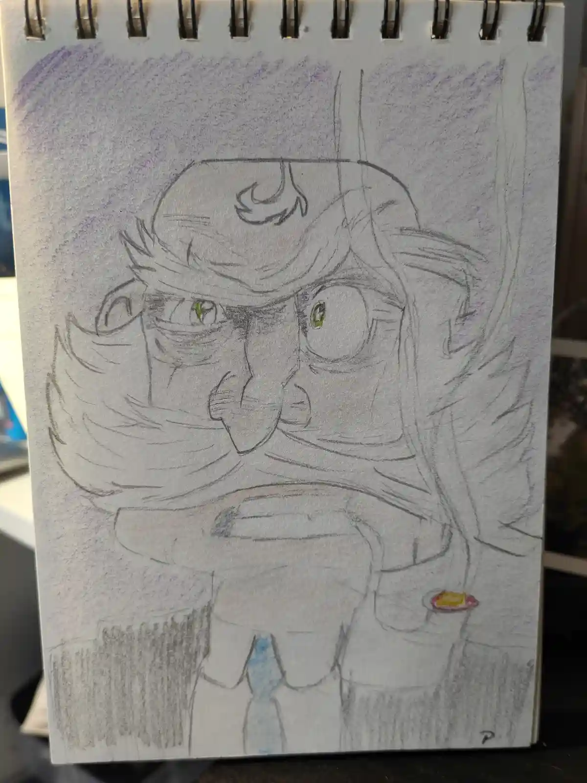 A hand-drawn sketch on a spiral-bound notebook page depicts a cartoonish character with exaggerated facial features…