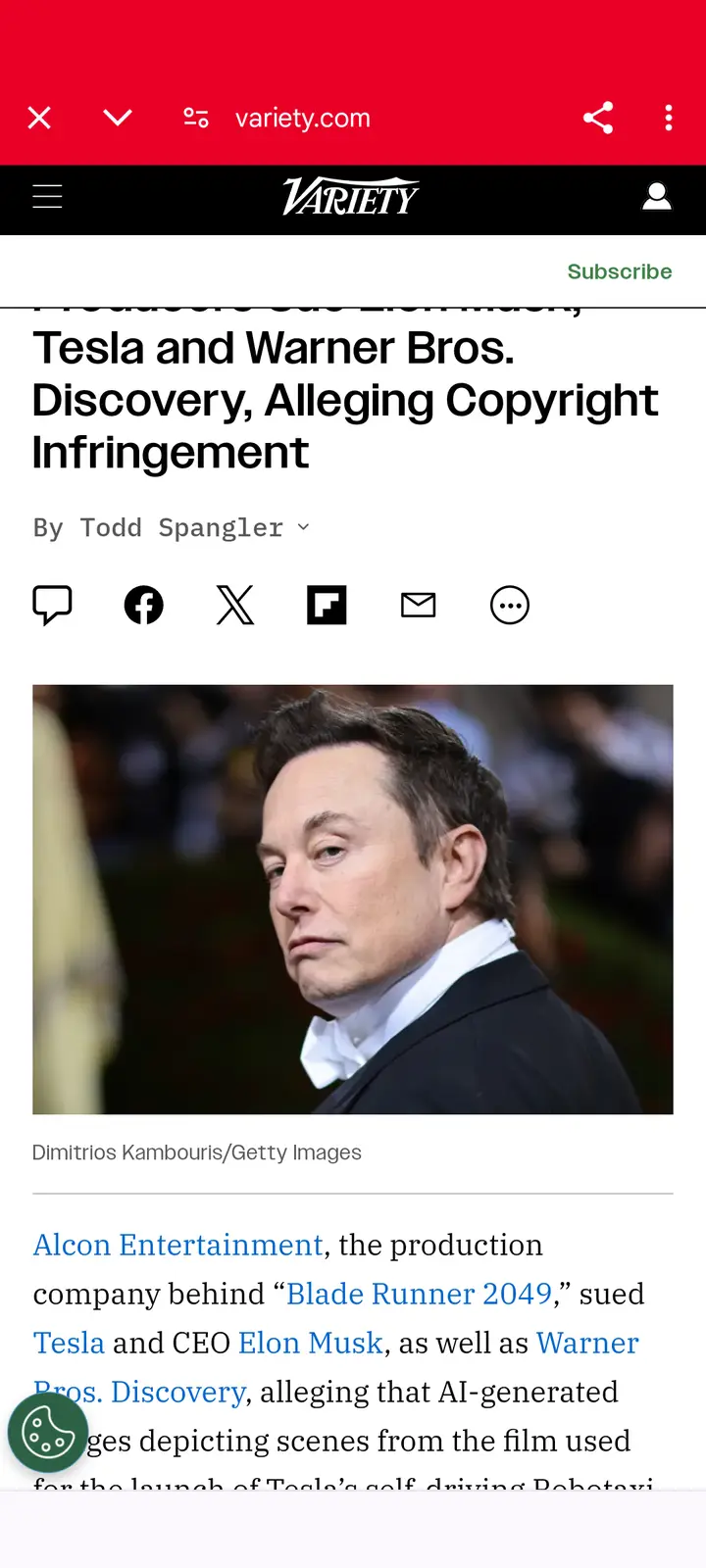 A screenshot of a Variety.com news article shows a photo of Elon Musk looking serious and slightly annoyed. The headline…