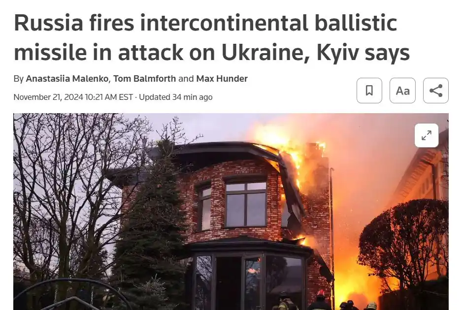A screenshot of a news article headline about Russia firing an intercontinental ballistic missile at Ukraine, overlaid on a…