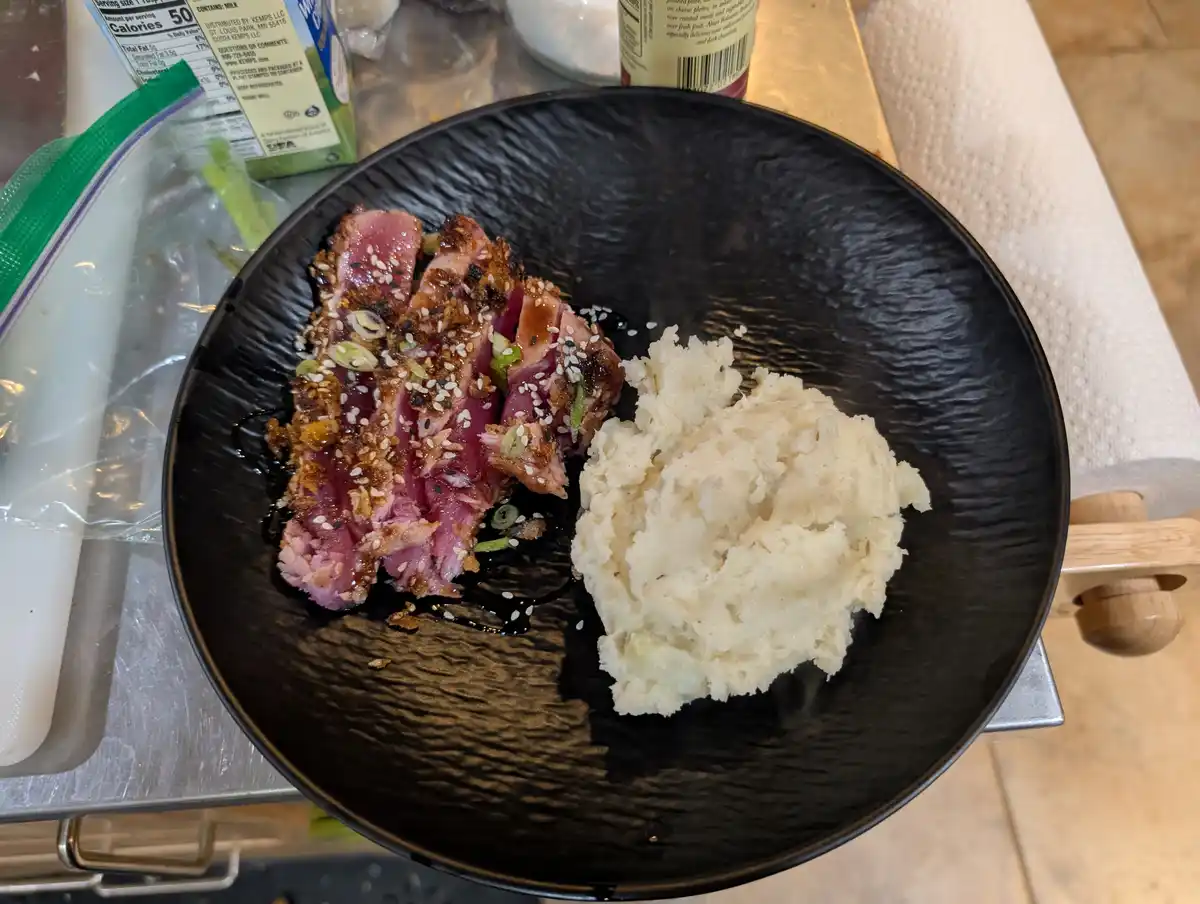 Gourmet Sesame-Crusted Tuna Steak with Balsamic Reduction and Parmesan Potatoes