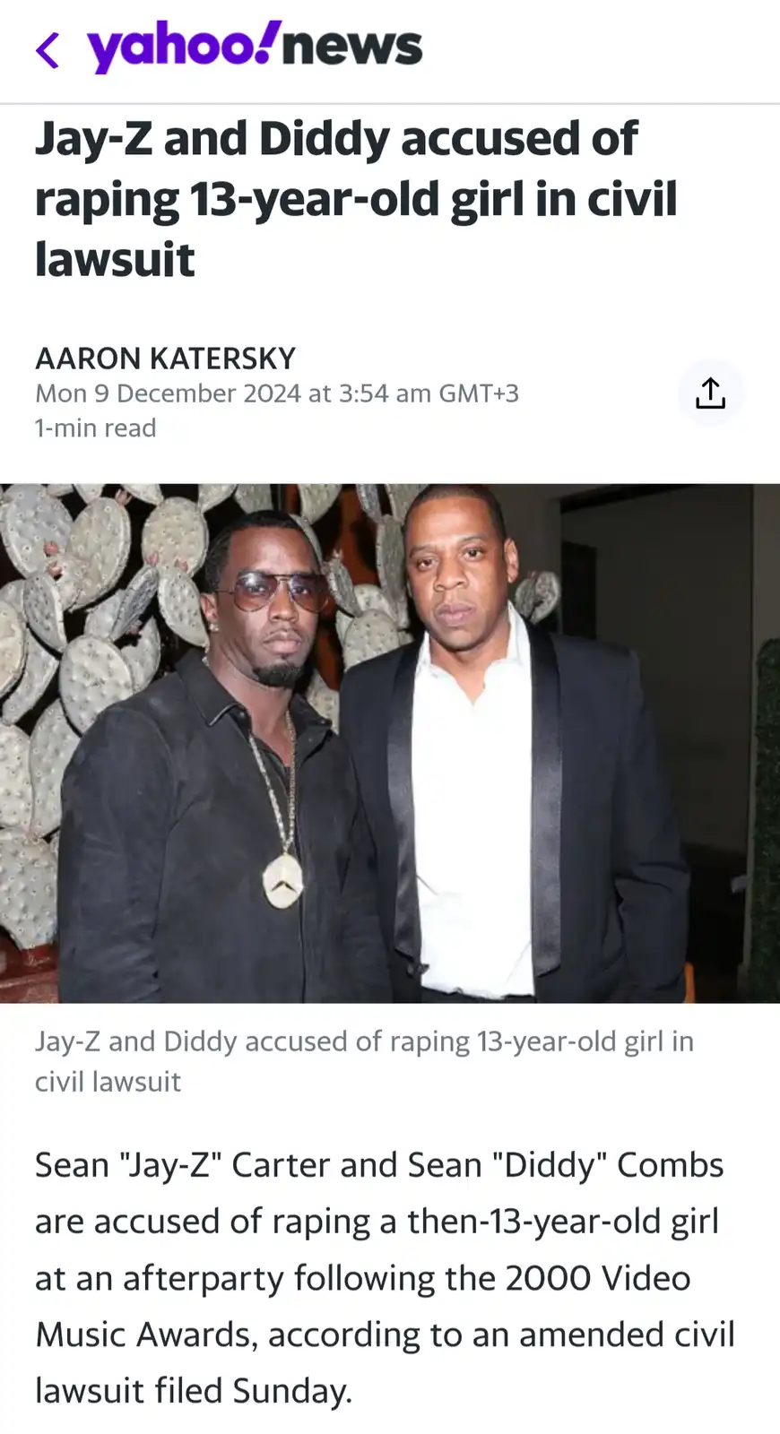 A screenshot of a Yahoo News article with a headline and photo of two men, Jay-Z and Diddy, standing together. The article's…
