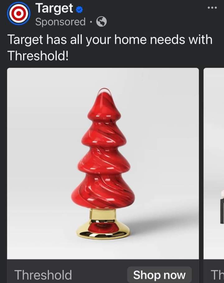 A sponsored Target Facebook ad displays a red, glossy, spiral-shaped Christmas tree ornament on a gold base. The ad text…
