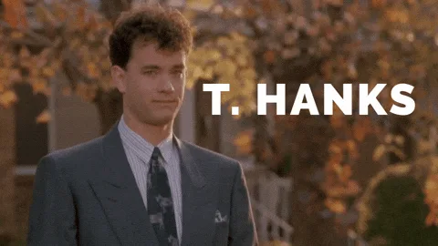 The image displays six identical panels of Tom Hanks in a suit, standing outdoors with autumn leaves in the background. In…