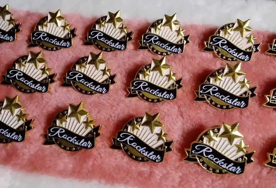 My Daughter's 'Rockstar' Pins from Goodwill Turned Out to Be Employee-of-the-Month Awards!