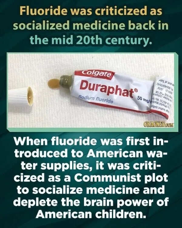 An image of a partially squeezed tube of Colgate Duraphat toothpaste, labeled 'Sodium fluoride', with its cap beside it on a…