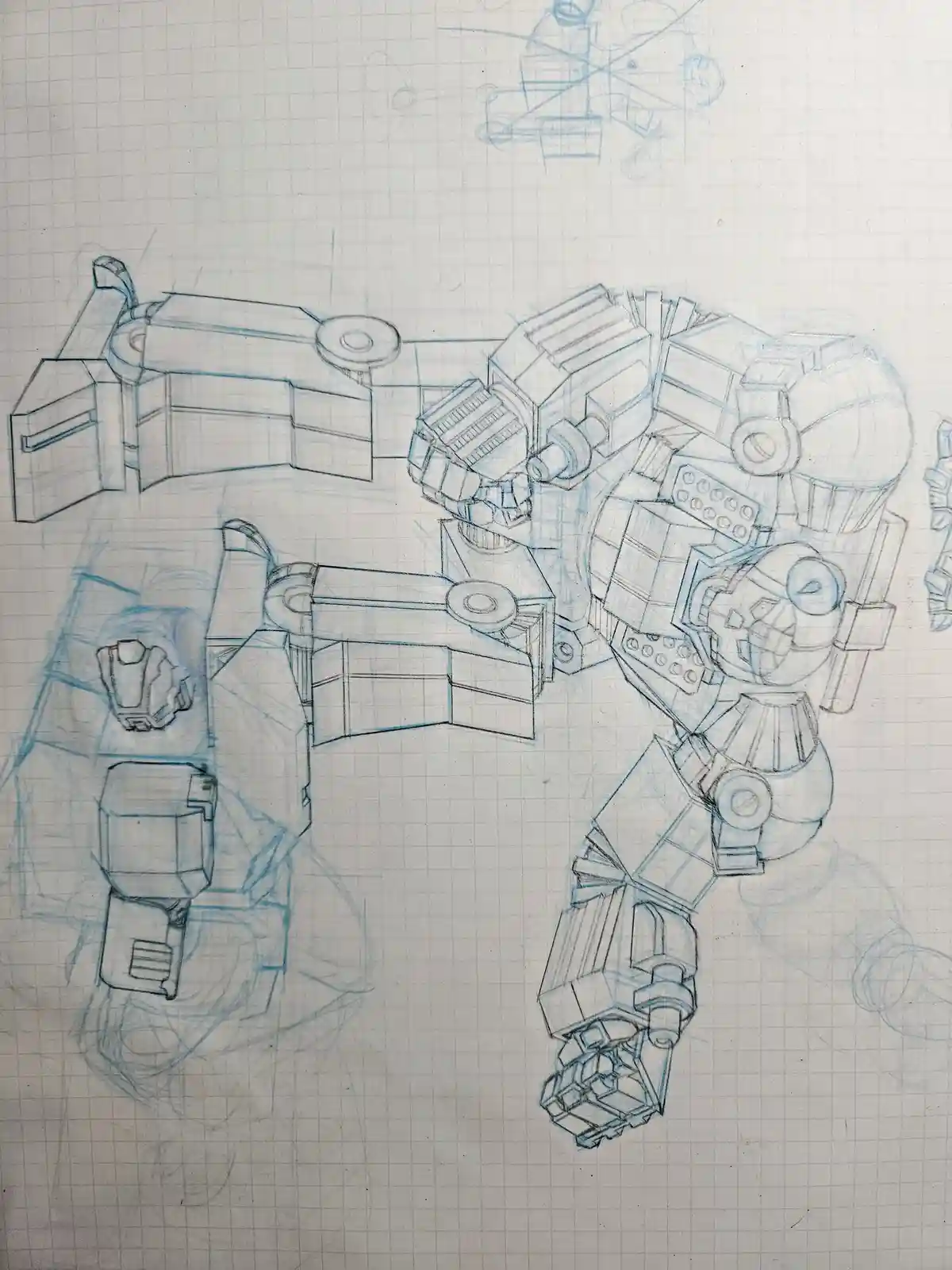 A blue pencil sketch on graph paper shows a detailed, blocky robot design with visible limbs, torso, and mechanical joints…