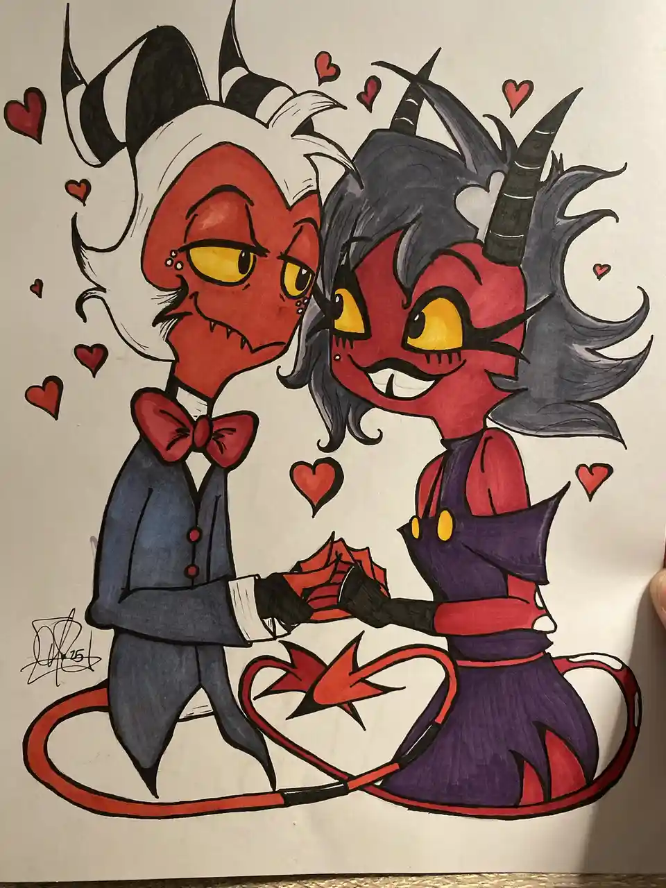 Two cartoonish red-skinned devil characters with horns and tails are holding hands and surrounded by floating red hearts…