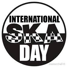 A black and white circular logo with bold text reading 'INTERNATIONAL SKA DAY'. The word 'SKA' is stylized with a checkered…