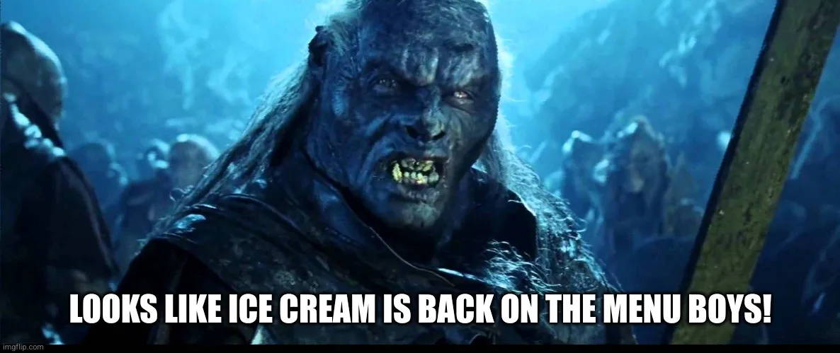 A close-up of a blue-skinned, menacing orc with sharp teeth and wild hair, set against a dim, blue-lit background with other…