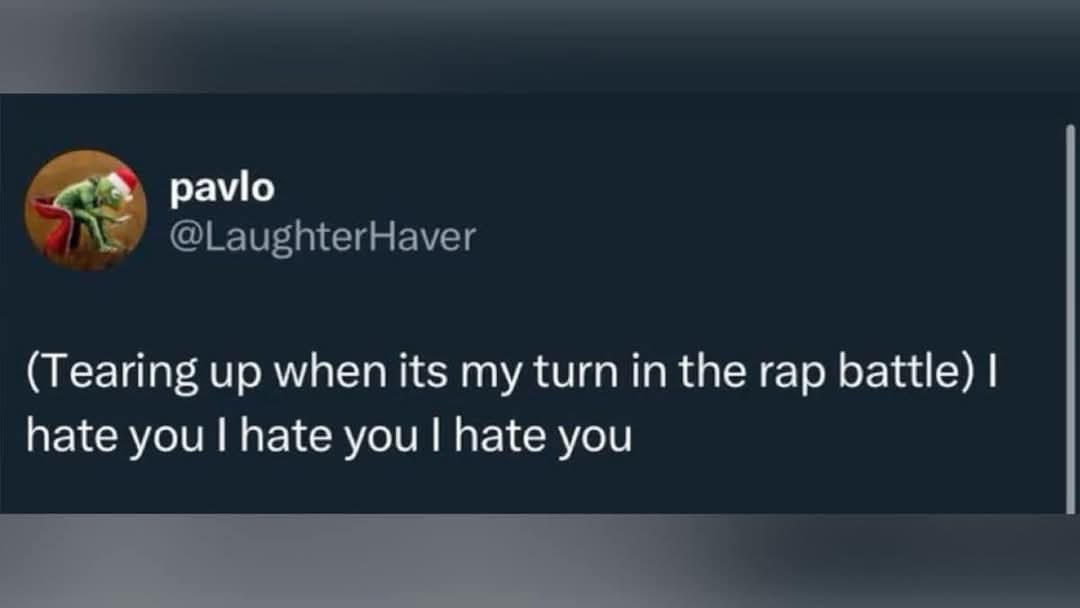 A screenshot of a Twitter post by user 'pavlo' (@LaughterHaver) showing a green frog wearing a red Santa hat in the profile…