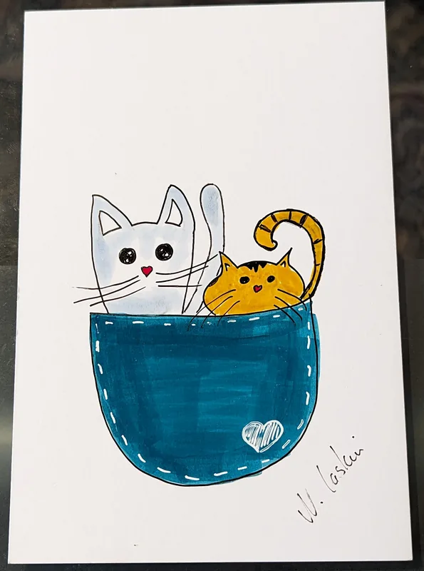 A hand-drawn illustration shows a white cat and a yellow tabby cat peeking out from a blue denim pocket, both with simple…