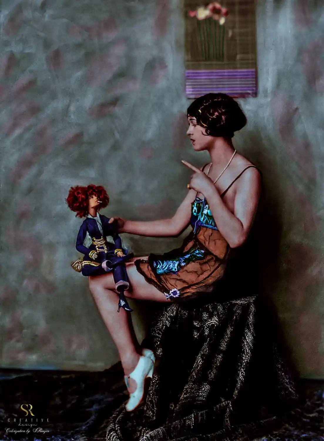 A vintage-style colorized photograph shows a woman in a 1920s flapper dress sitting on a patterned rug, pointing…