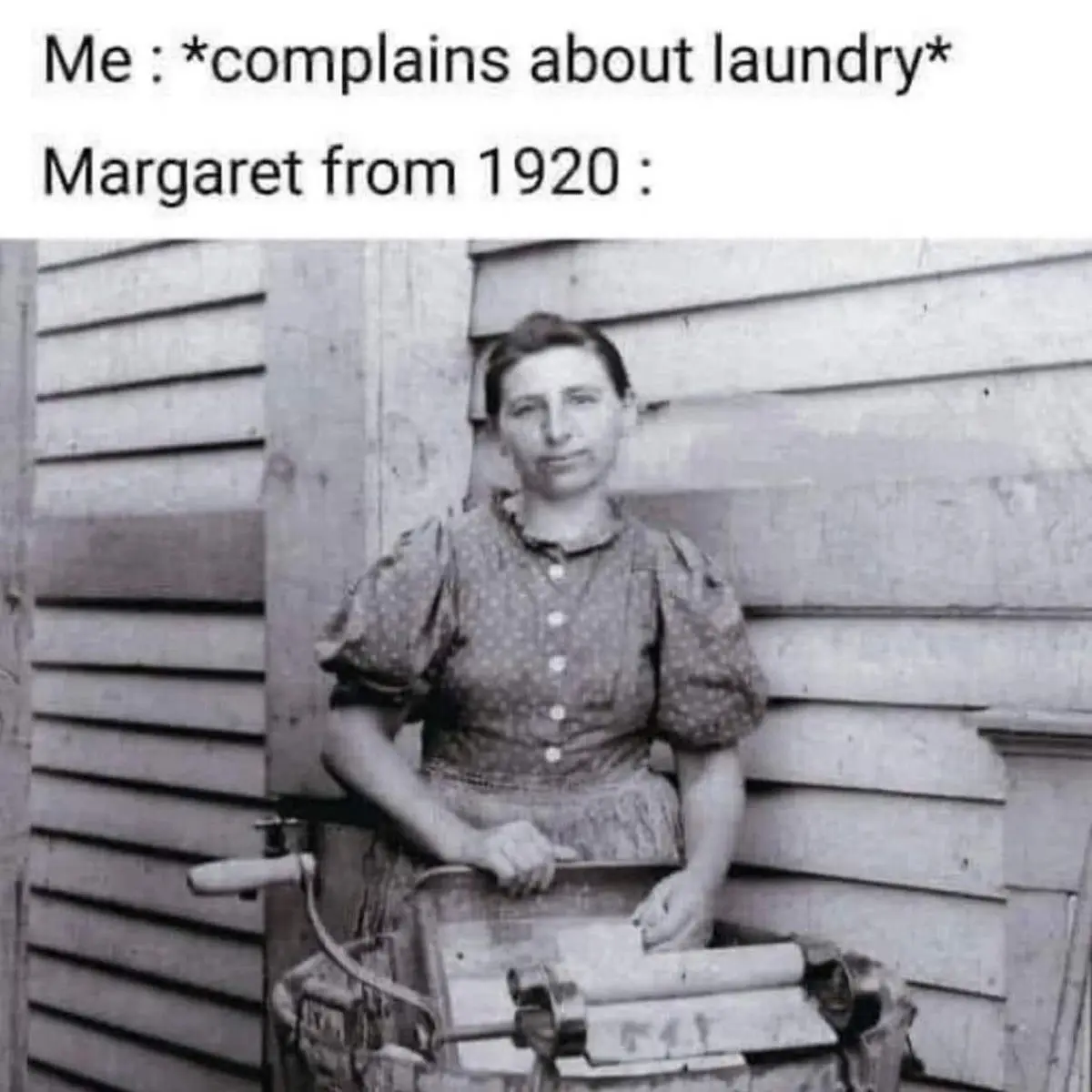 A black-and-white historical photo shows a woman named Margaret from 1920 standing beside a large, manual clothes wringer…
