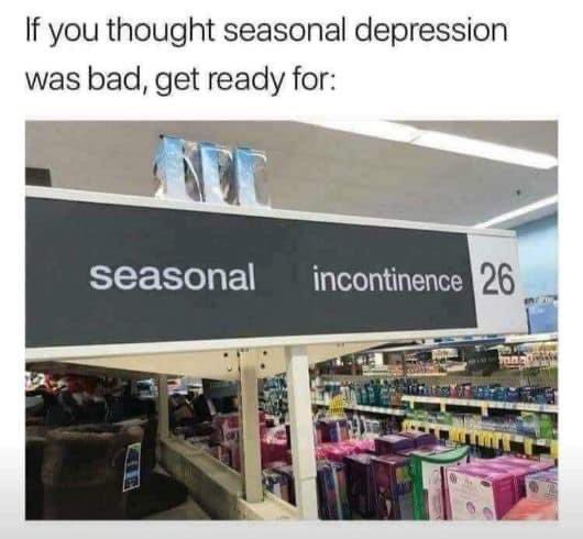 A photo of a store aisle with a black sign that reads 'seasonal incontinence 26', humorously implying that 'seasonal…