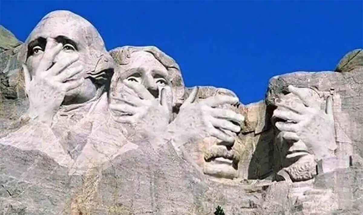 The image shows the Mount Rushmore National Memorial with the carved faces of four U.S. presidents. Each face has been…